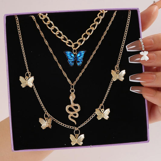 RAIRA Golden Butterfly & Snake Layered Necklace Set – Elegant Charm with a Bold Edge