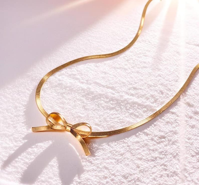 RAIRA Anti Tarnish Gold Plated Bow Necklace– Chic & Elegant Modern Statement Jewelry