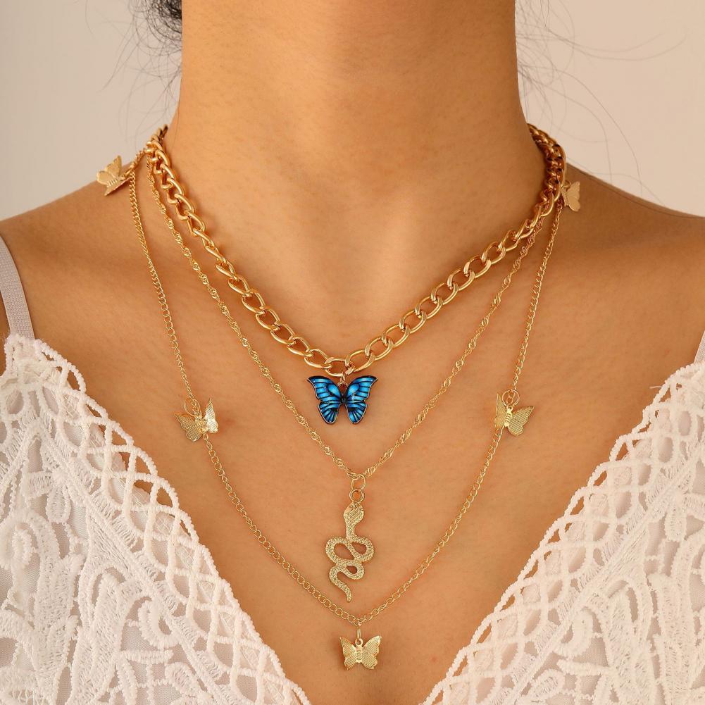 RAIRA Golden Butterfly & Snake Layered Necklace Set – Elegant Charm with a Bold Edge