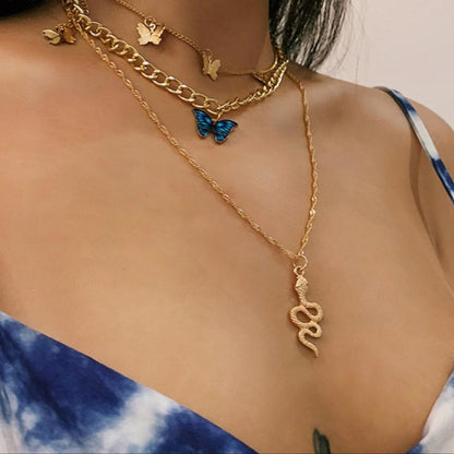 RAIRA Golden Butterfly & Snake Layered Necklace Set – Elegant Charm with a Bold Edge