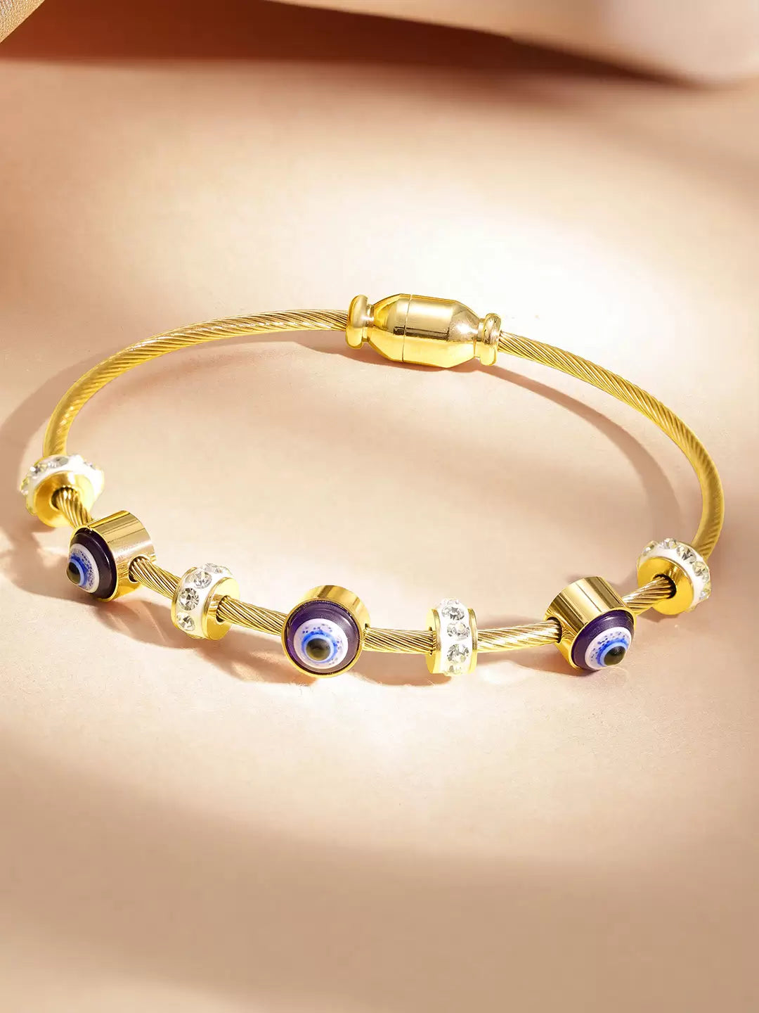 RAIRA Evil Eye Golden Bracelet for Women Stylish Adjustable Golden Kada with Anti-Tarnish Finish Crystal Accents and Magnet Accessories Elegant Evil Eye Bangles for Girls and Women