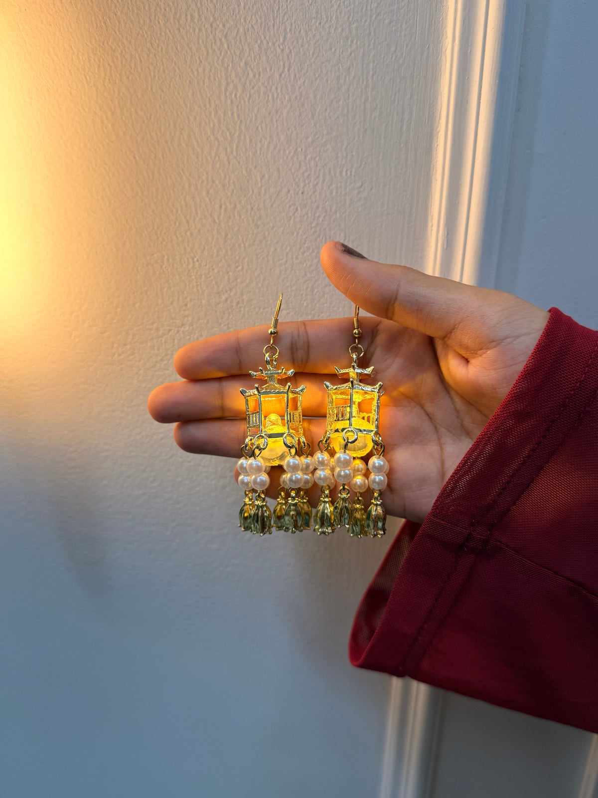 JugMug LED Lantern Light Jhumka Earrings Traditional Lantern LED Earrings, Traditional Lantern Pearl Tassel Earrings
Traditional Lantern Pearl Tassel Earrings, Handicraft kottage Pagoda Style Dangle Earrings, Pearl Beads And Tassles Earring For Women & Girls, Vintage Statement Earrings For Wedding, Anniversary, Birthday, Party & Gifting

