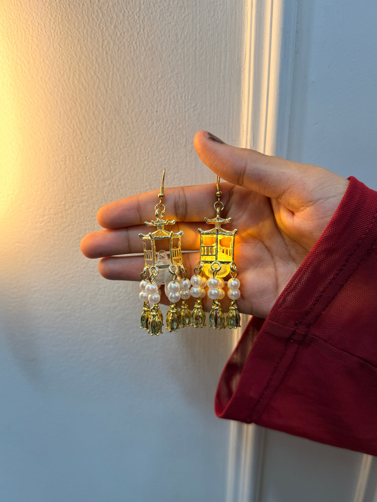 Traditional Lantern LED Earrings , Unique Lantern Design: Traditional-inspired golden jhumka earrings., Traditional Lantern Pearl Tassel Earrings

